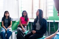 Three teens in a session.