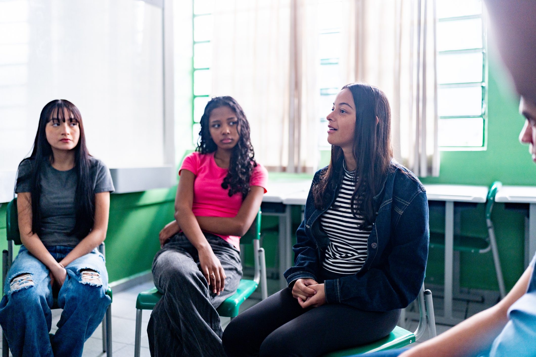 Three teens in a session.